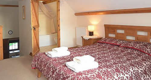 Galleried bedroom at the Boathouse with great views over the lake and towards Bodmin Moor